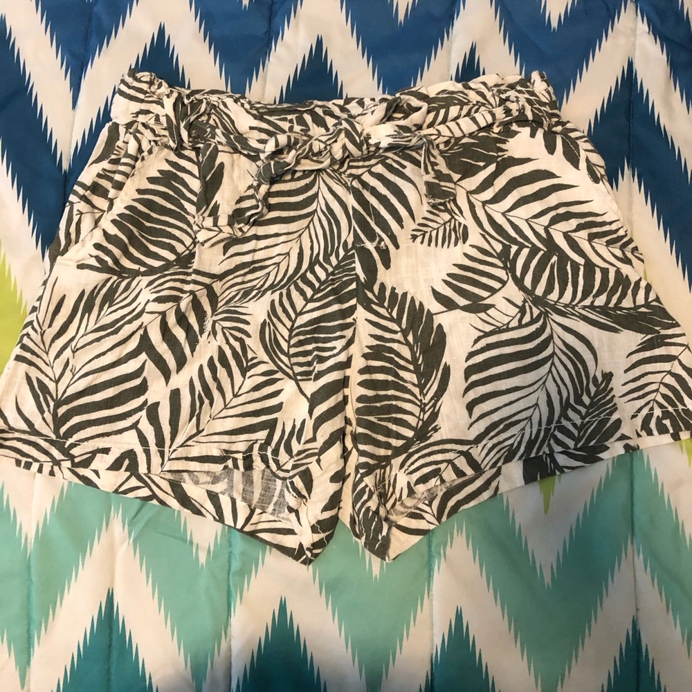 Green and white tropical shorts.